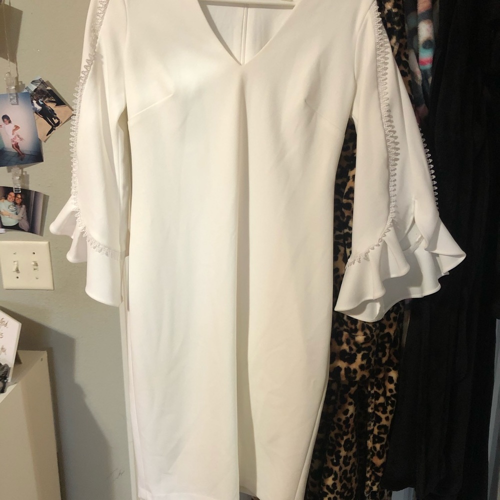 This is a gorgeous, white Calvin Klein dress!